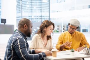 Business woman exchanging building and renovation ideas with a realtor