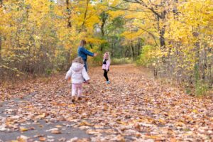 Family playing outside in fall